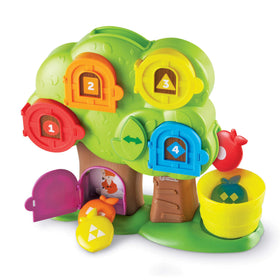 Learning Resources Hide & Seek Treehouse front door open promotes early number and color recognition.
