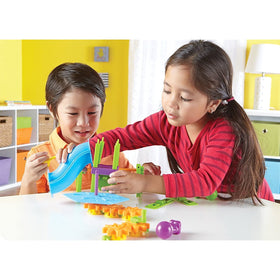 Learning Resources playground storage box holds all components for organized, kid-friendly setup.