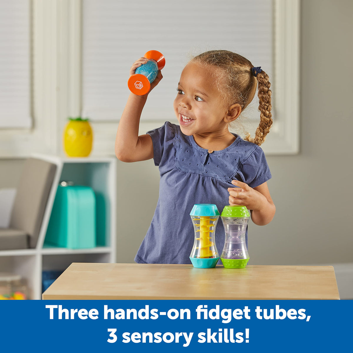 Learning Resources Sensory Trio Tubes glitter swirl reveals hidden smileys and visual tracking.