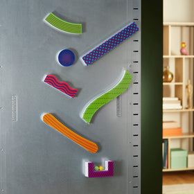Learning Resources Tumble Trax track pieces connect magnetically for quick reconfigurations.