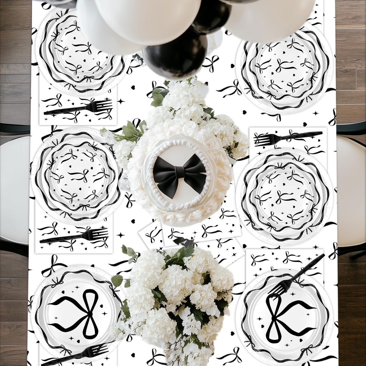 Lecheme Black Bow forks complete the chic dining setup.