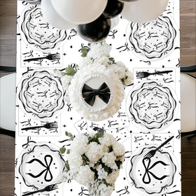Lecheme Black Bow forks complete the chic dining setup.