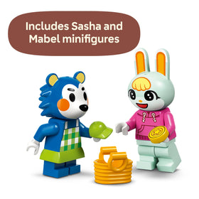 Mini sewing machine and scissors for pretend alterations in LEGO set.