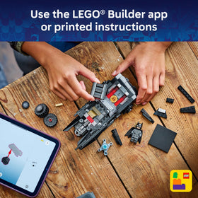Display-ready LEGO Batmobile on shelf as room decor.
