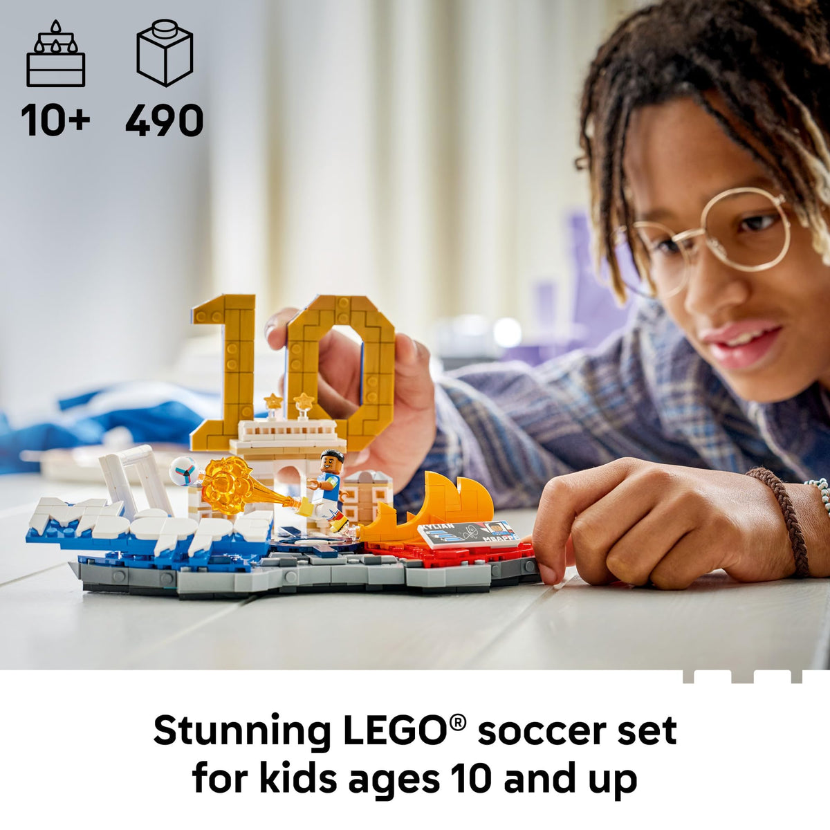 Lego Editions Kylian Mbappé number 10 figure highlights iconic jersey on shelf.