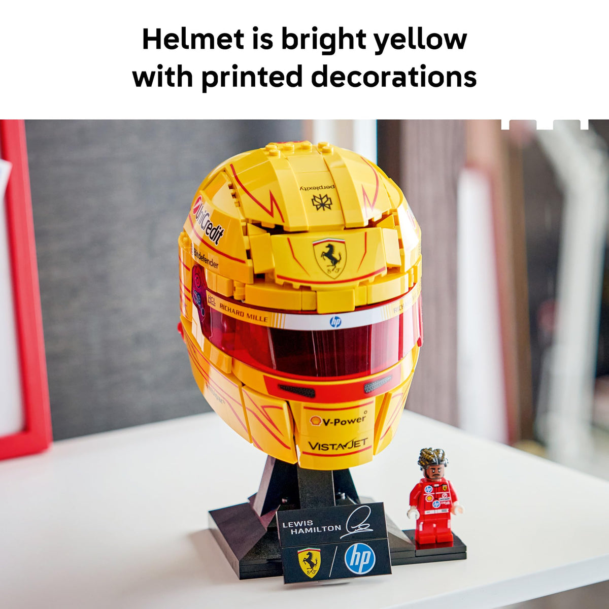 Hamilton minifigure in red Ferrari suit completes the scene