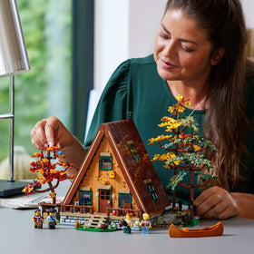 LEGO Ideas A-Frame Cabin minifigures and animals for storytelling.