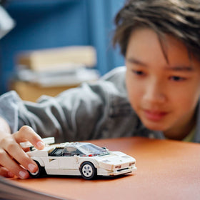 Lego Countach minifigure with helmet enhances racing storytelling.