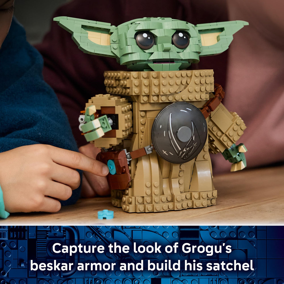 LEGO Star Wars Grogu satchel with blue cookie inside emphasizes playful accessories.