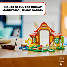 Yellow Yoshi figure greets LEGO Mario for imaginative adventures and stories.