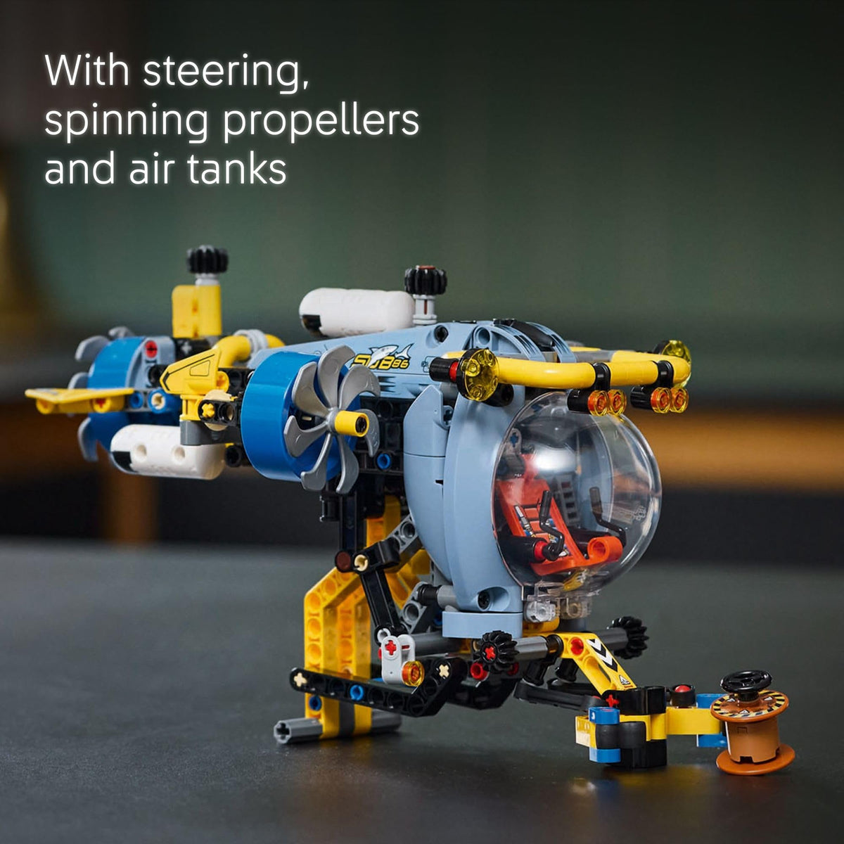 LEGO Technic Deep-Sea Submarine extending arm demonstrates grabbing and lifting pretend sea cargo