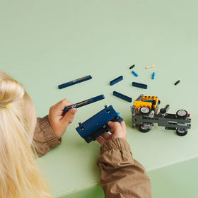 LEGO Technic Dump Truck 42147 tipper lift demonstrates load-dumping action
