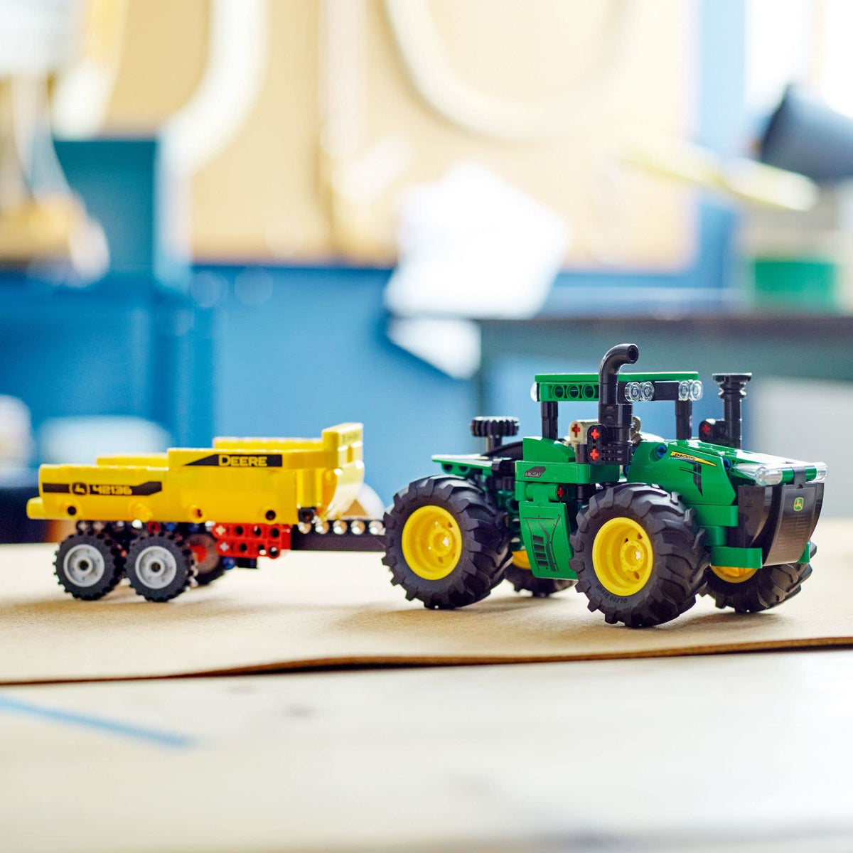 LEGO Technic John Deere 9620R tipping trailer demonstrates load-ready functionality.