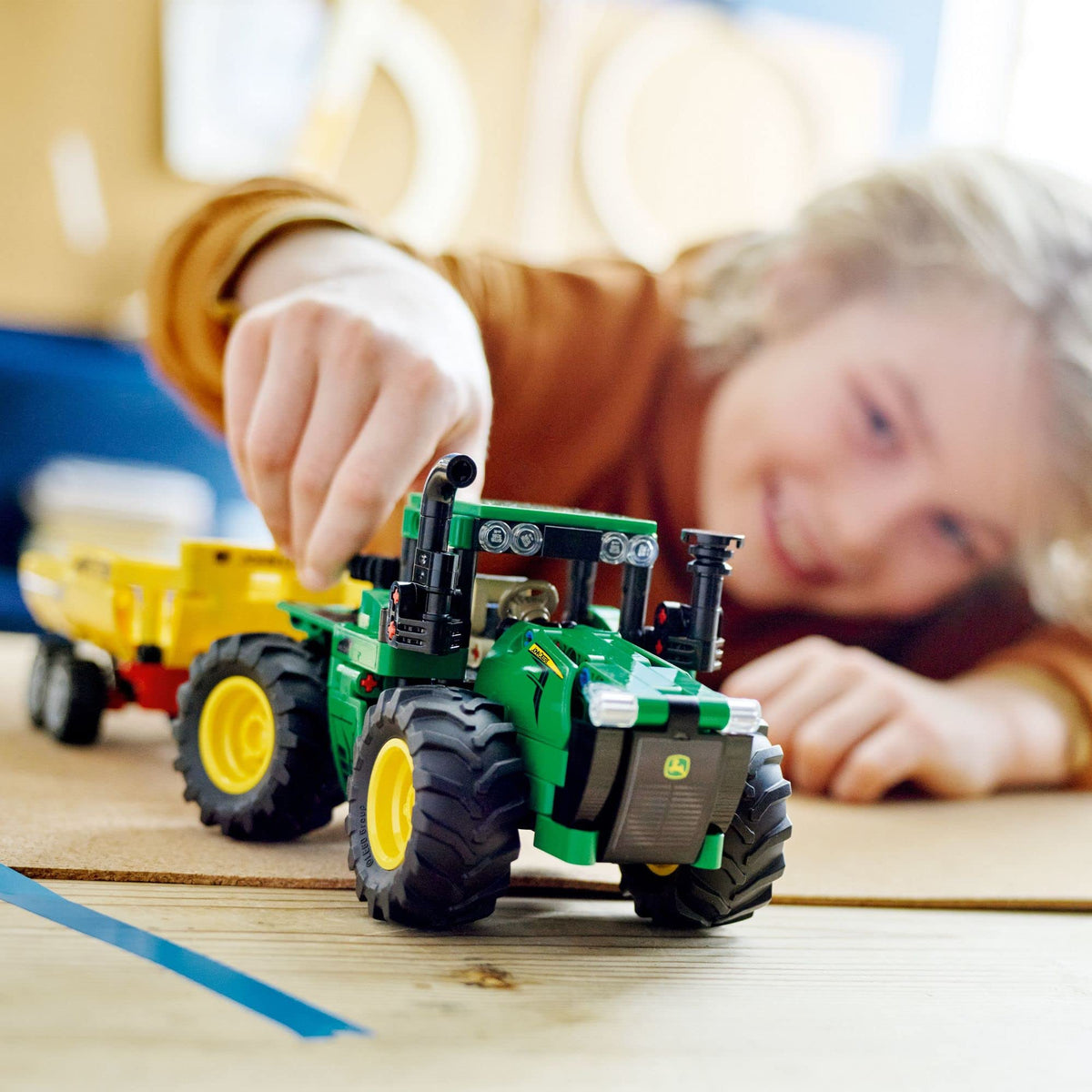 LEGO Technic John Deere 9620R tractor cab detail featuring turning seat for authentic control.