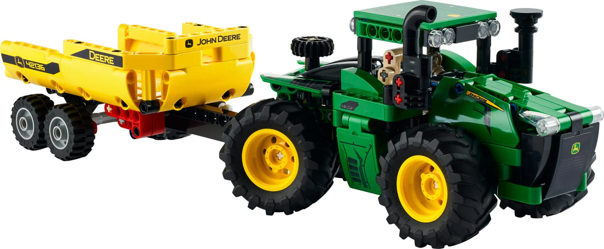 LEGO Technic John Deere 9620R tractor on terrain shows rugged play.