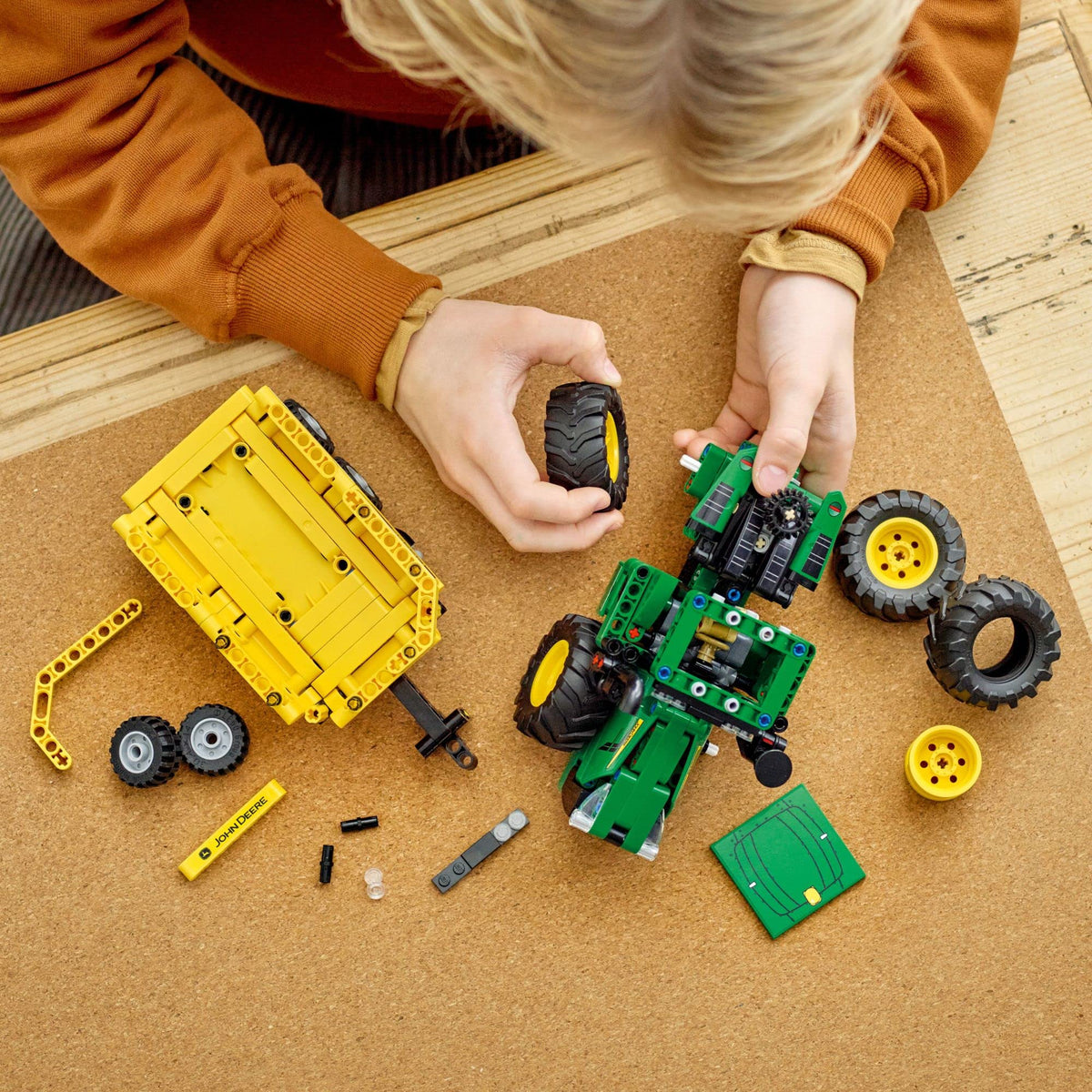 LEGO Technic John Deere 9620R tractor steering mechanism image highlights responsive handling.