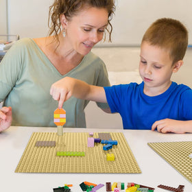 Lekebaby blue baseplates provide stable foundations for complex city builds.
