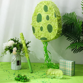 Lenwen dinosaur egg pinata hanging green, ready to serve as a colorful party centerpiece and activity.