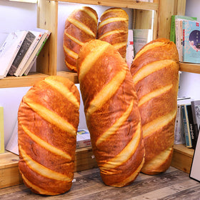 Levenkeness bread plush pillow used as home decor accent.