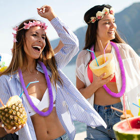 Lewtemi leis used as wall decor, table drapes, and photo backdrops