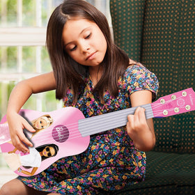 Lexibook Barbie My First Guitar child playing to spark early music interest