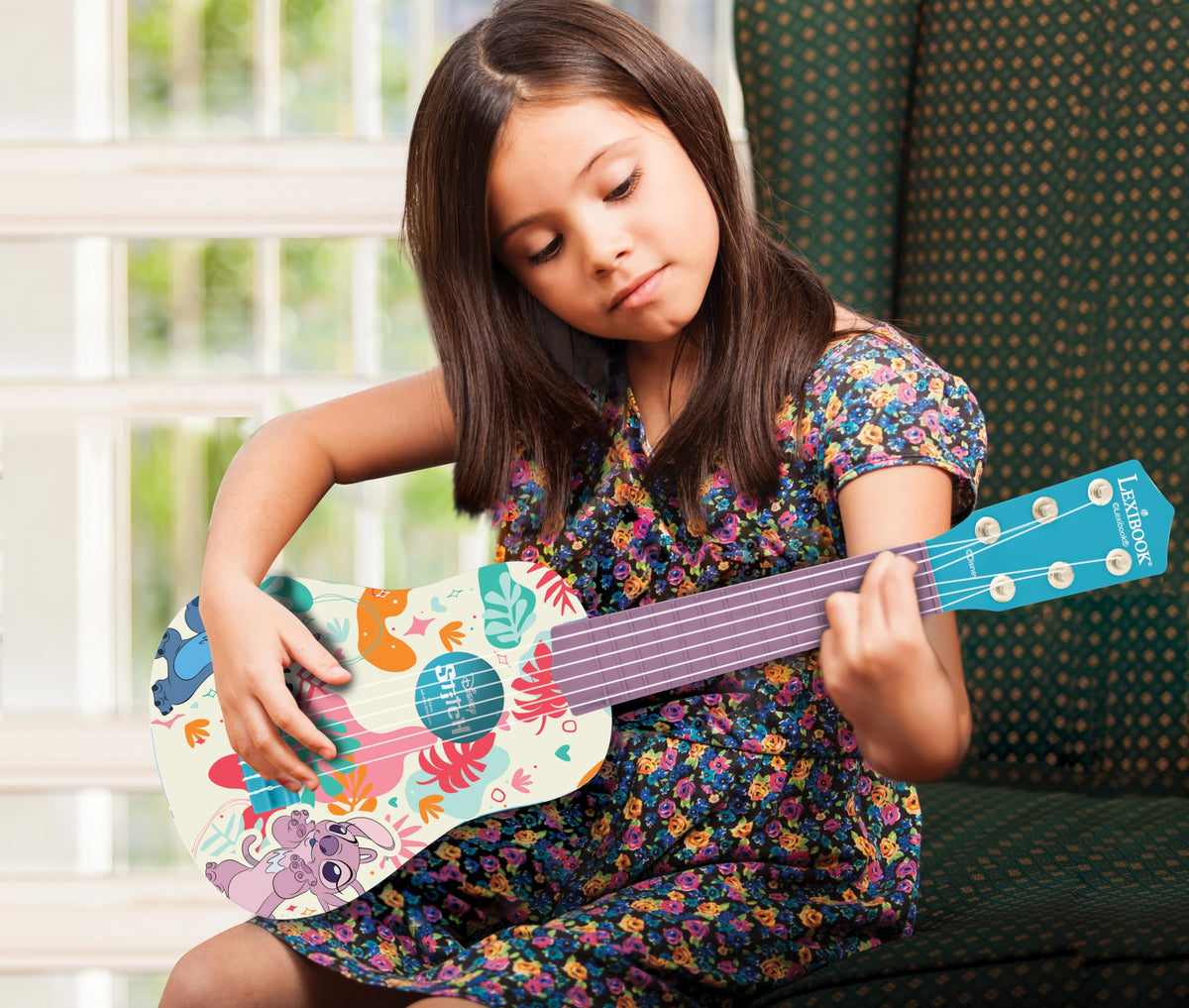 Lexibook durable blue plastic guitar designed for children and easy handling.