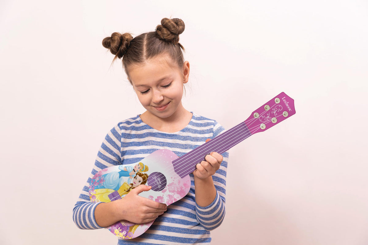 LEXiBOOK Disney Princess guitar in use by a child shows lightweight design.