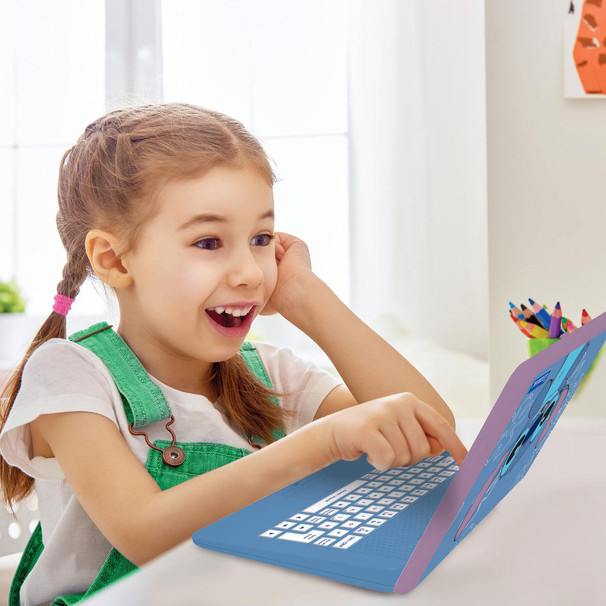 Laptop screen displaying animated bilingual activities for language learning