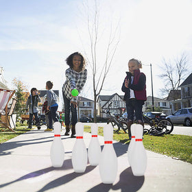 Liberry kids bowling set in action during a sunny outdoor session.