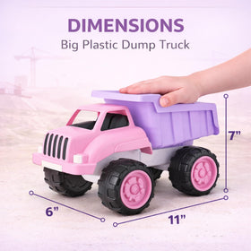 Close-up of Liberty Imports pink dump truck in a sandbox playground.