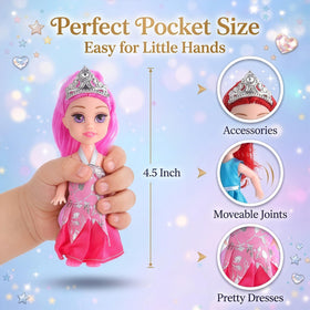 Close-up of shimmering dresses and matching tiaras on miniature princess dolls.
