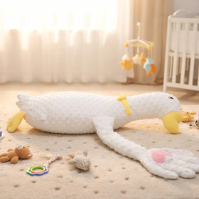 LiKiLiKi Goose plush with pink heart decor on hand.