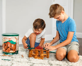 Lincoln Logs roof and chimney pieces enable realistic small-house builds.