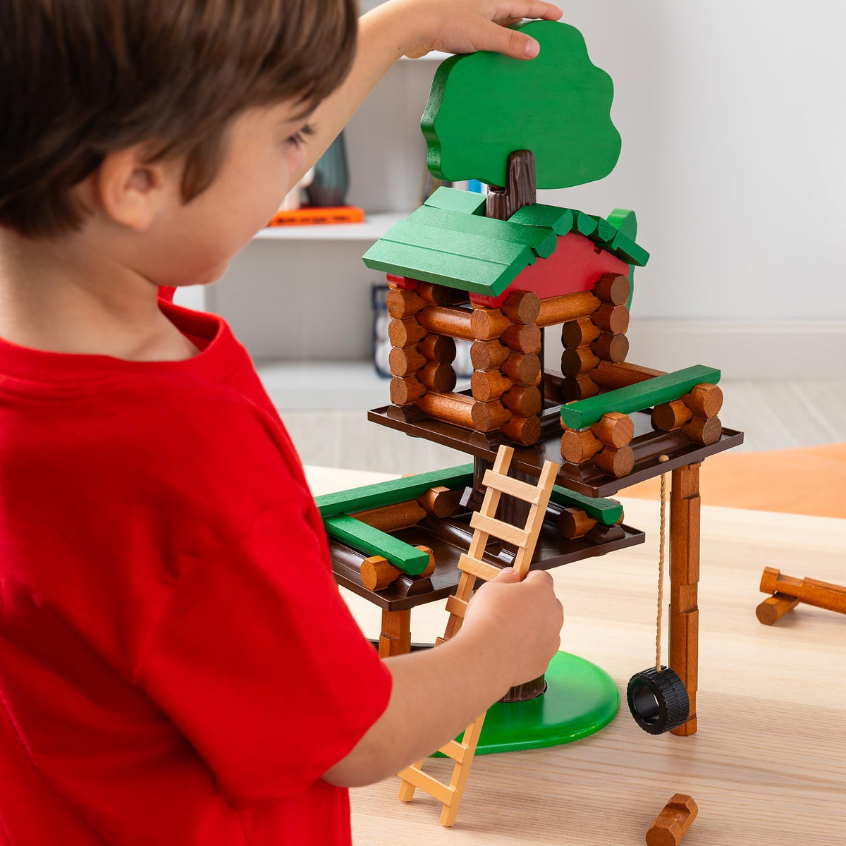 Lincoln Logs tree trunk and branch pieces enabling sturdy builds