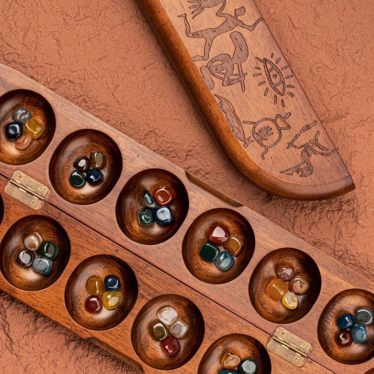 Lingle Deluxe Mancala 48 natural multicolor stones ready for tactile strategy.
