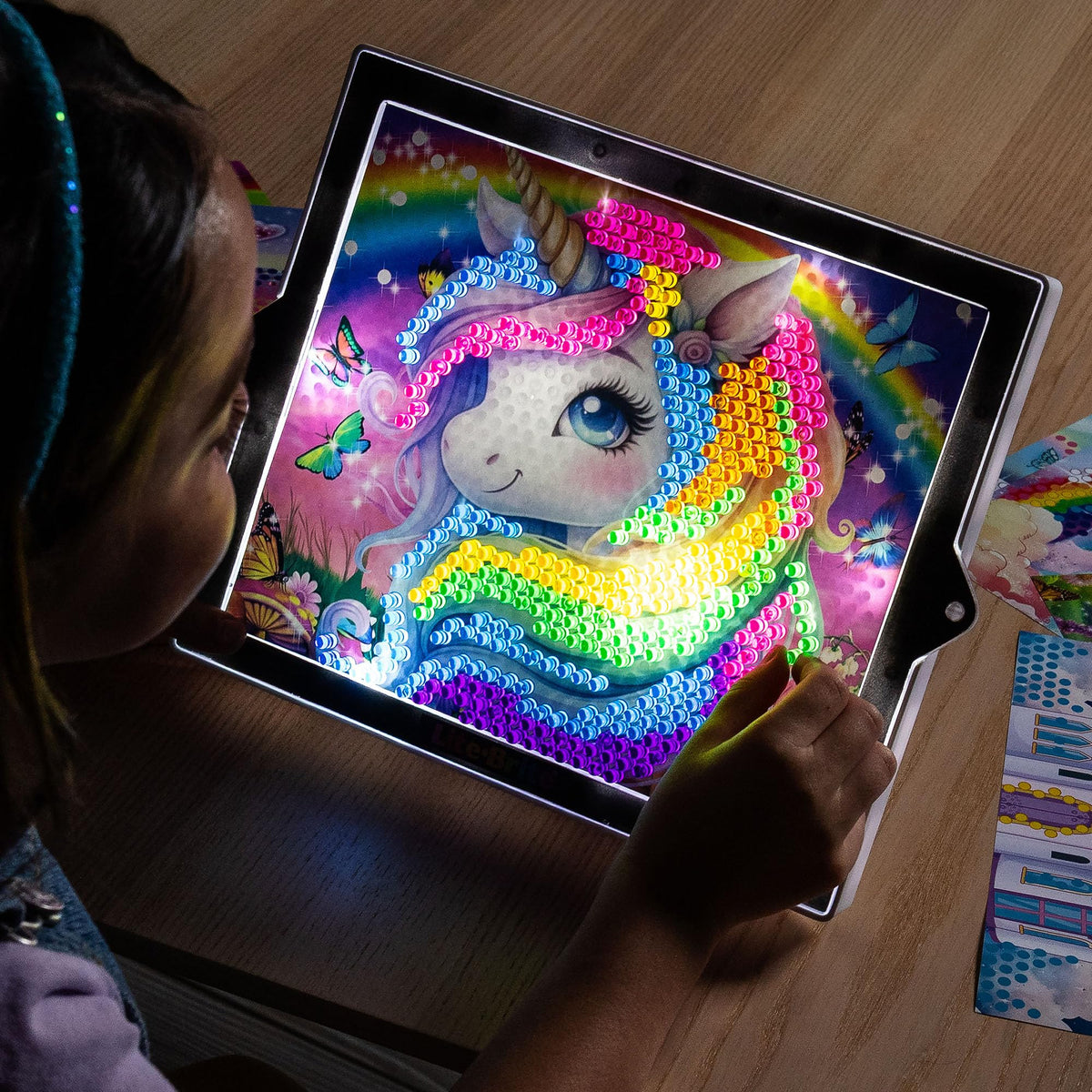 Lite-Brite Color Pop pull-out easel displays glowing artwork proudly