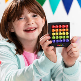 Lite Brite Touch Mini in use with Tic-Tac-Toe game on the grid