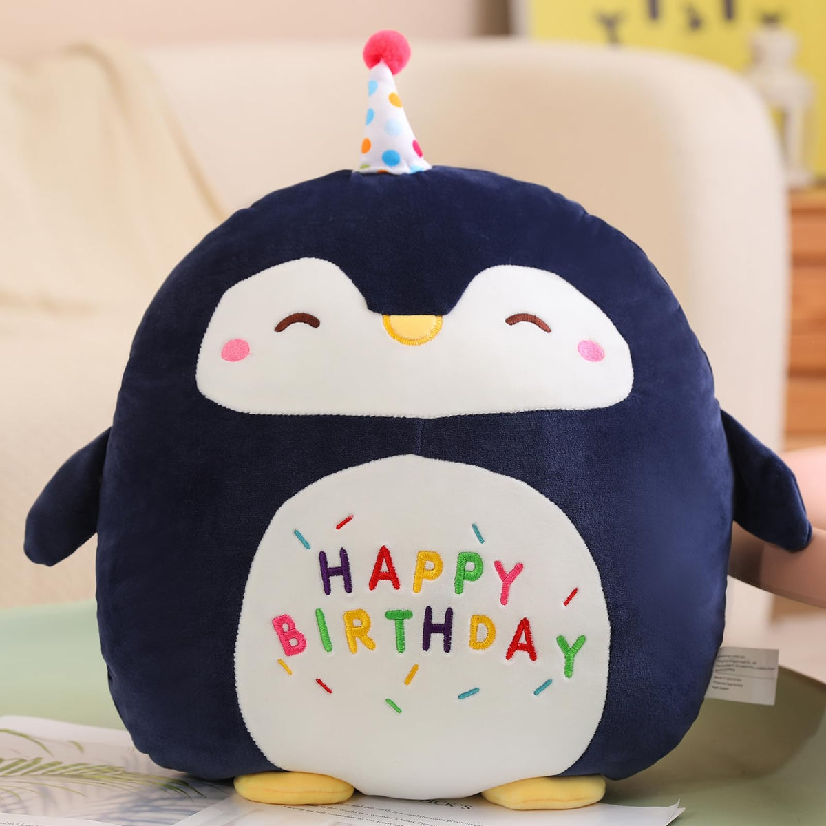 Litence penguin plush with embroidered Happy Birthday detail for a festive keepsake.