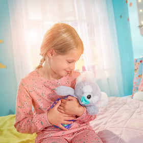 Close-up koala hug promotes comforting moments during bedtime rituals