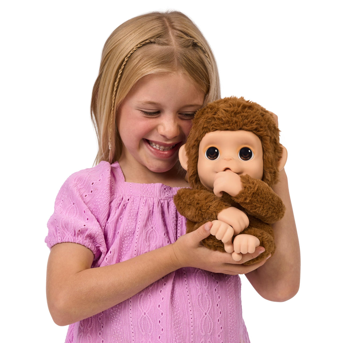 Little Live Pets Mango gripping hands pose for monkey-like pretend play.
