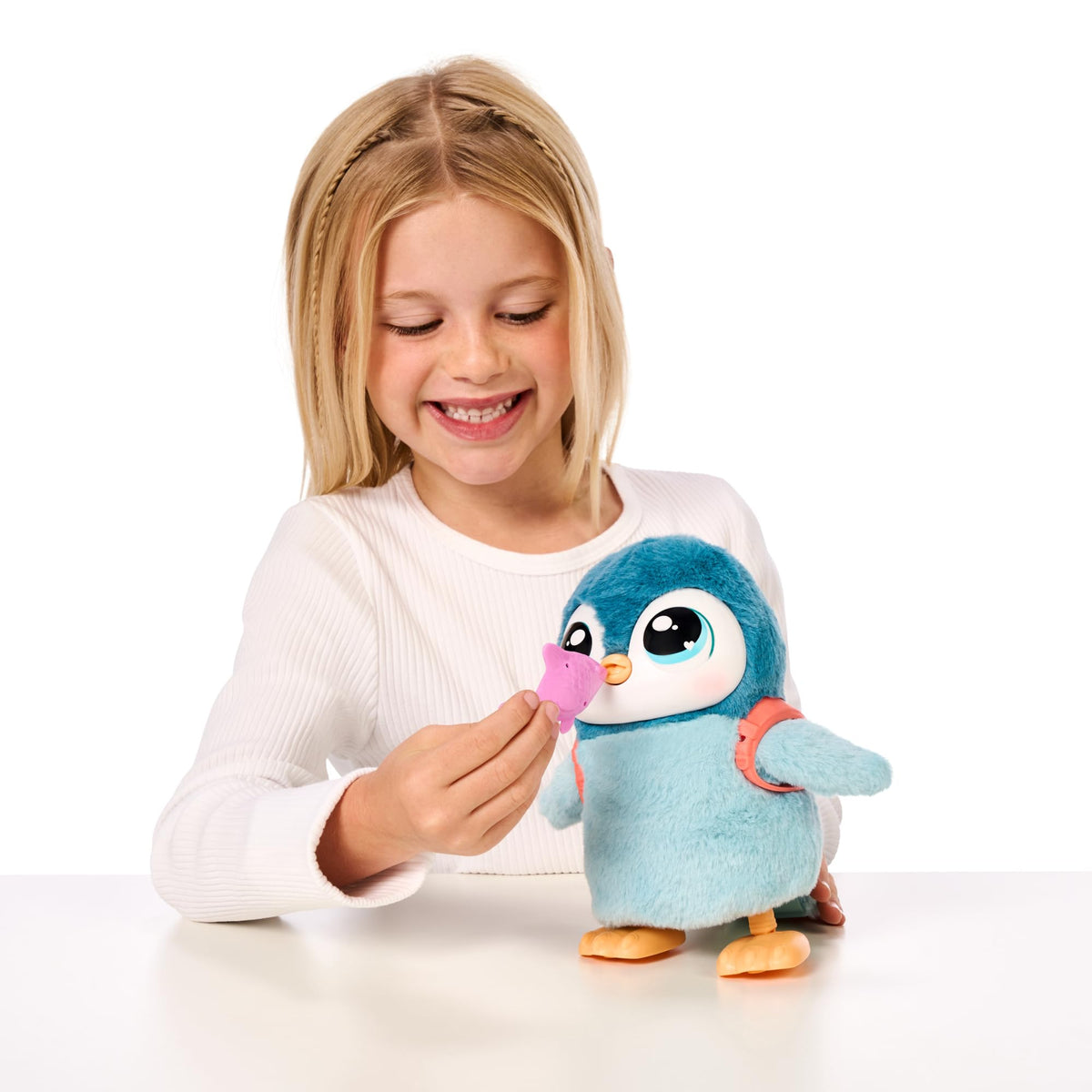 Little Live Pets Walking Penguin feeding with burp reaction for authentic play.