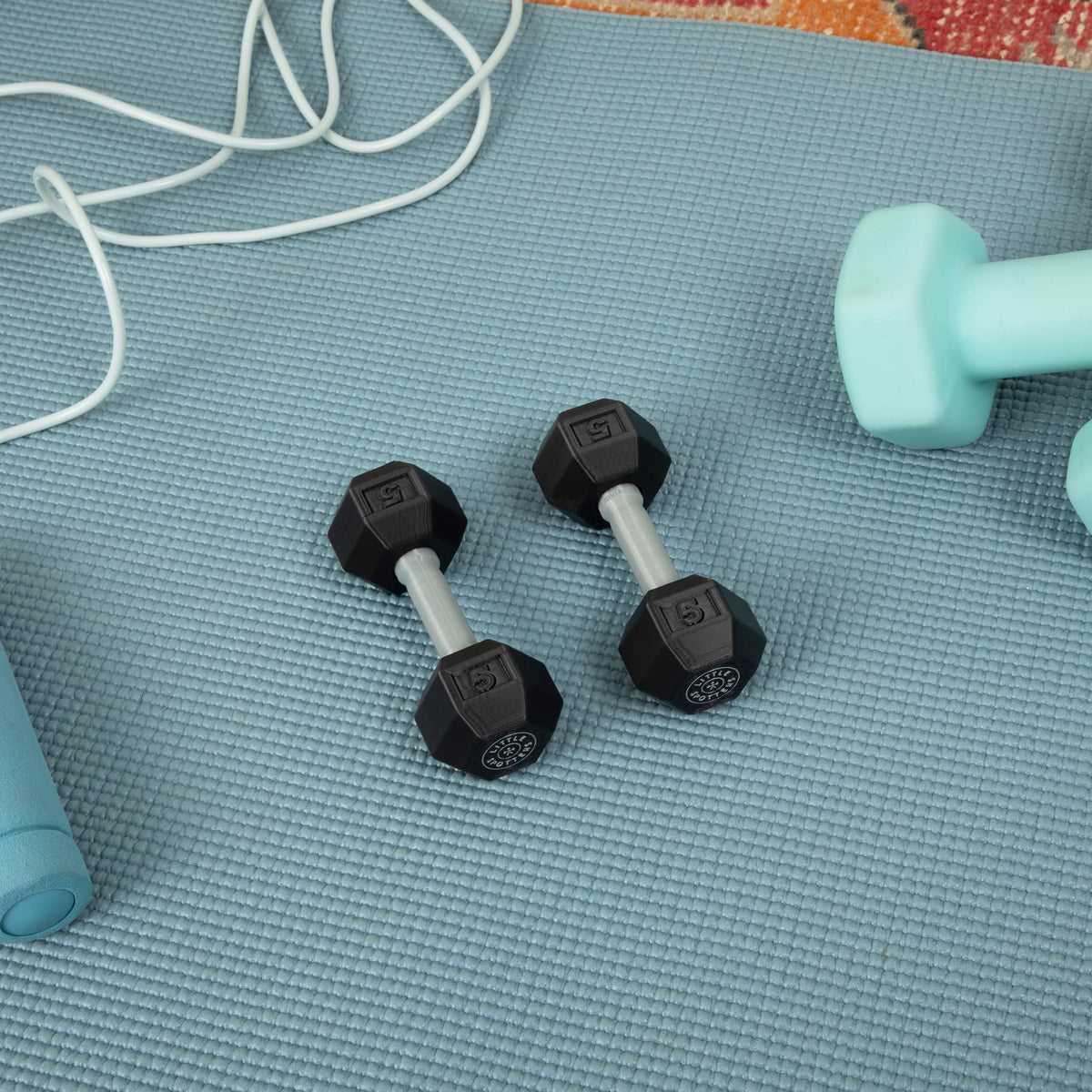 Little Spotters baby rattles resemble real dumbbells for relatable parent-child moments