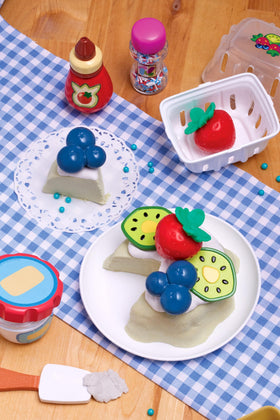 Sprinkles and toppings container add visual flair to pretend baking
