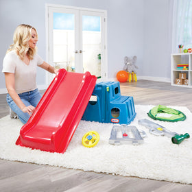 Spinning steering wheel on Little Tikes Easy Store Slide & Explore supports pretend play.