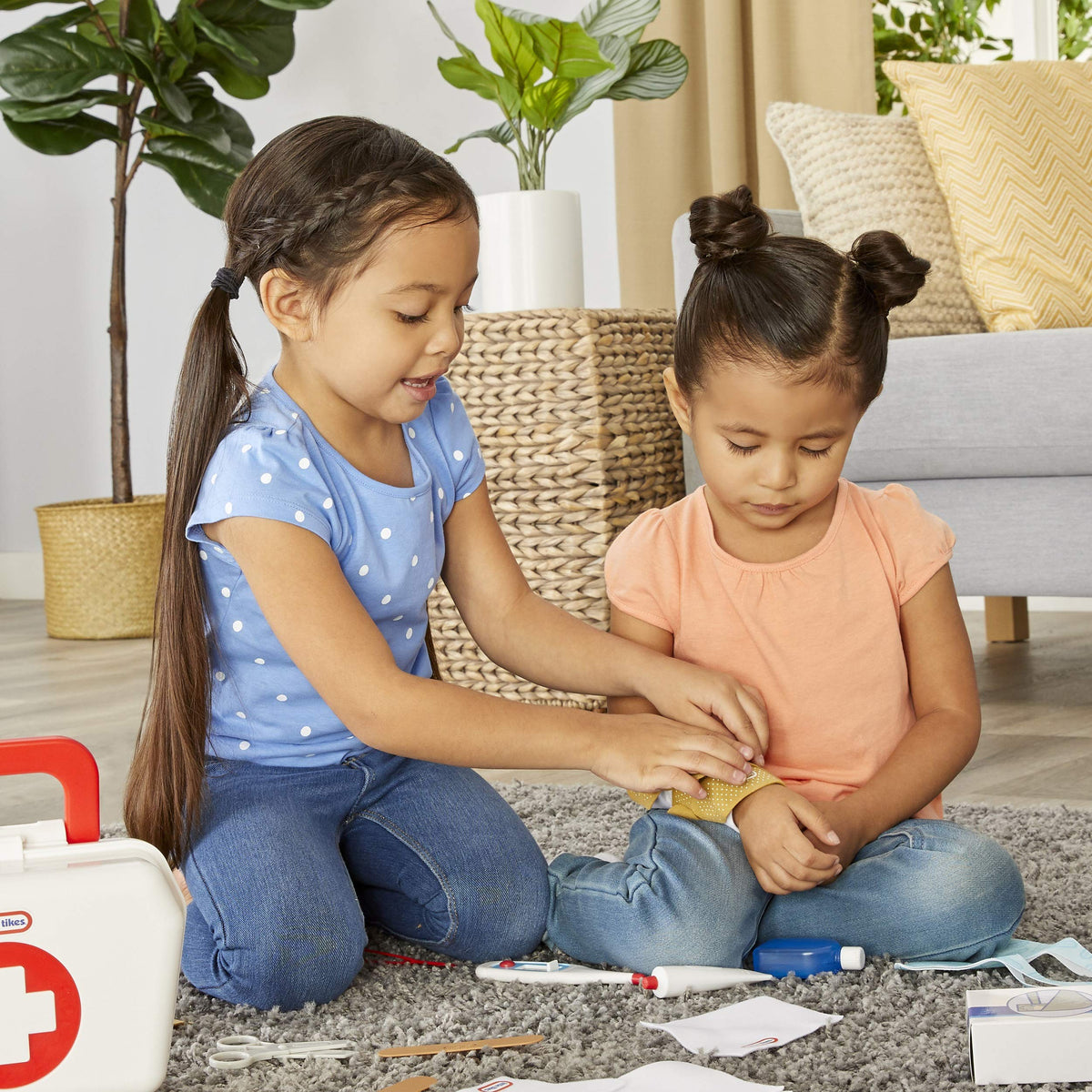 Little Tikes First Aid Kit arm sling and thermometer illustrate patient care play