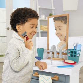 Under-sink storage keeps accessories organized after playtime.