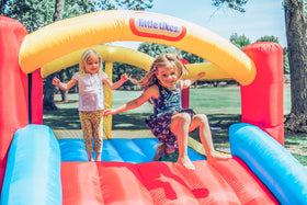 Little Tikes Jump 'n Slide Bouncer with heavy-duty blower for quick setup outdoors