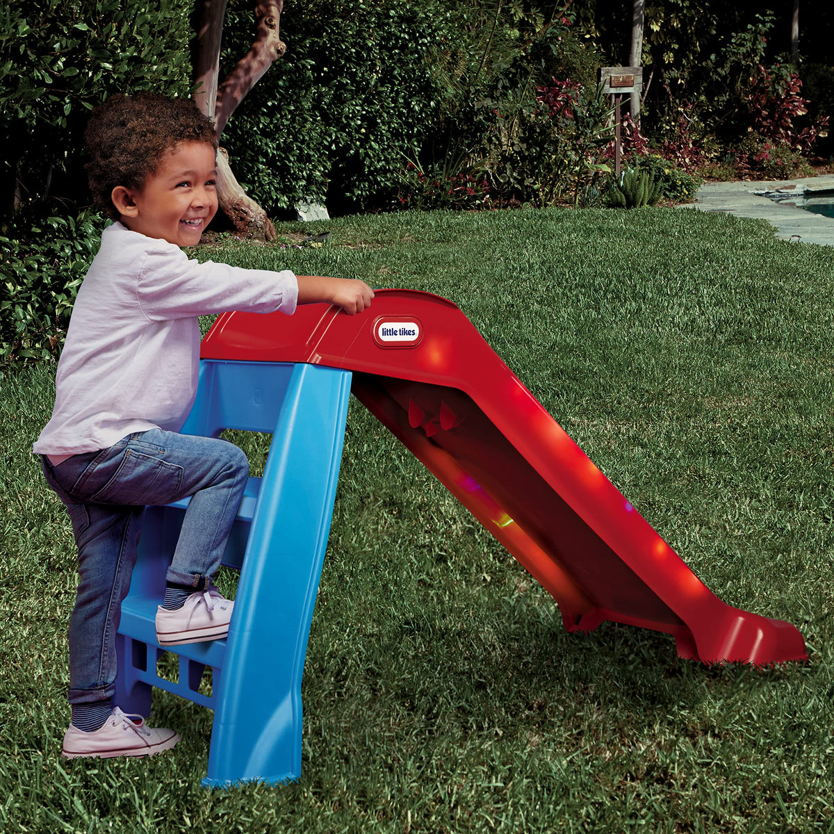 Little Tikes Light-Up First Slide shown indoors and outdoors for versatile use.