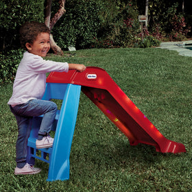 Little Tikes Light-Up First Slide shown indoors and outdoors for versatile use.