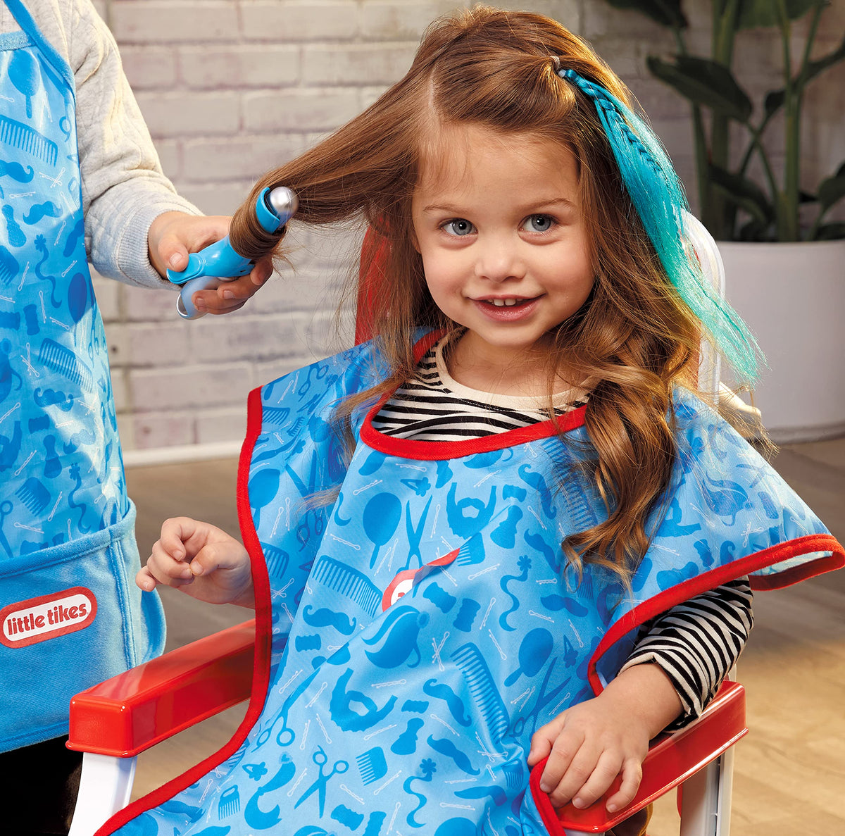 Little Tikes Style Station kid-safe mirror for checking hairstyles and designs.